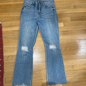 Ripped boot cut blue jeans
